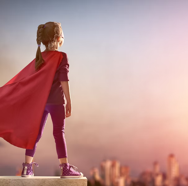 Success - Person with cape on mountain