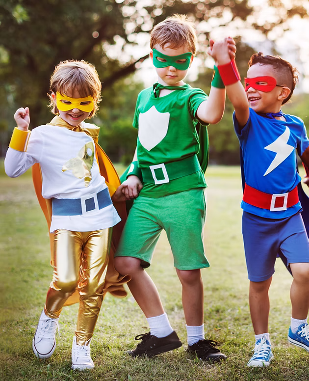 Community First - Kids in superhero costumes